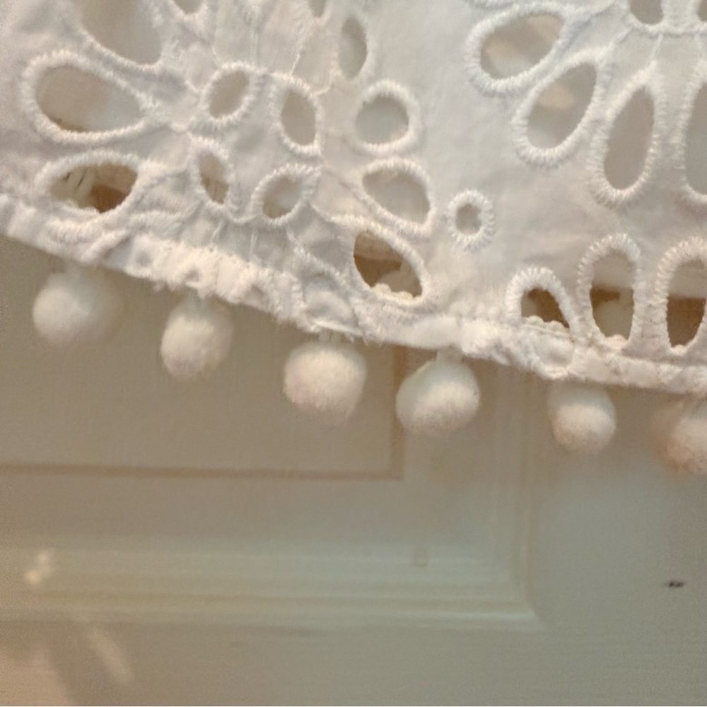 Your summer goto Lilly Pulitzer White Eyelet Off-Shoulder Tunic with PomPom Trim - Picture 5 of 10